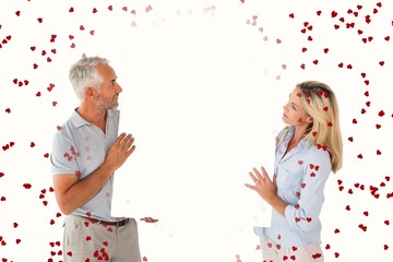 Aufkleber - Composite image of happy couple holding large poster