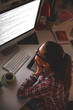 © BalanceFormCreative - Young female programmer working at home.