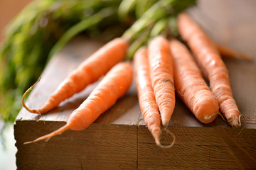 Wall Mural - Carrot on a wooden table