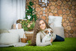 © NatBud - The girl is lying in the floor with the dog. Girl with dog.