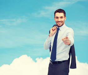 Canvas Print - handsome businessman with jacket over shoulder