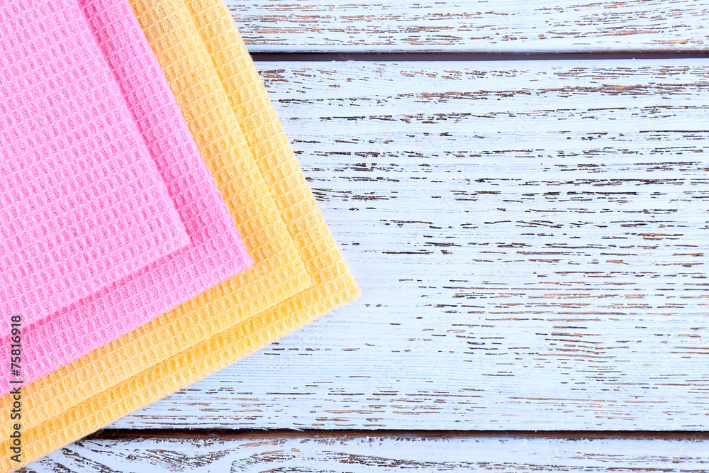 Colorful napkins on wooden table