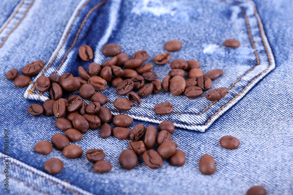 Coffee beans on the jeans background