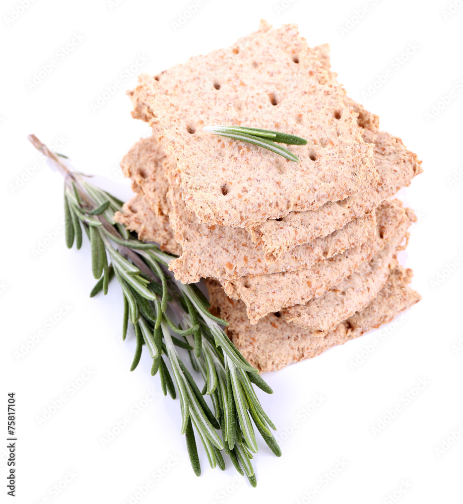 Crispbread with sprigs of rosemary isolated on white background