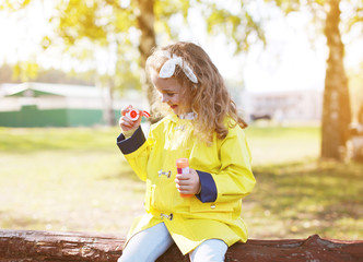 Wall Mural - Little child having fun outdoors in sunny warm day