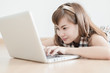 © Nonwarit - Asian woman using laptop at home