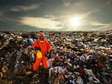 Recycling Worker Standing On The Landfill
