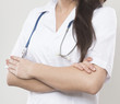 © tbaeff - young female doctor with cross hands