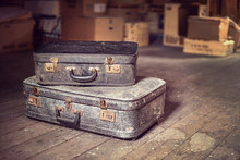 Old Vintage Suitcases In A Dusty Attic