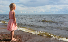 Small Girl At The Sea Shore