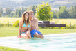 © william87 - Beautiful Young Couple Next to Swimming Pool