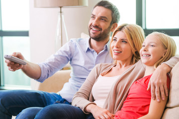 Canvas Print - Watching TV together.