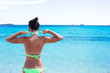 © travnikovstudio - Young beautiful girl relaxing at white sand tropical beach