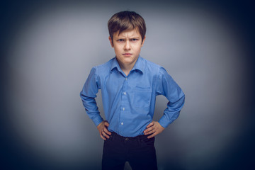 Wall Mural - portrait a teenage boy frowning brown hair of European appear