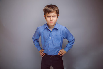 Wall Mural - portrait a teenage boy frowning brown hair of European appear