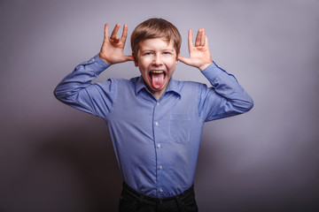 Wall Mural - boy fun showing tongue