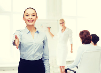 Poster - businesswoman with opened hand ready for handshake