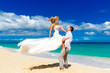 © frolova_elena - happy bride and groom having fun on a tropical beach