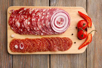 Wall Mural - Sliced salami with chili pepper, onion and spices