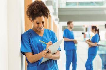 Wall Mural - medical student taking notes in hallway