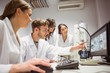 © WavebreakMediaMicro - Science students looking at microscopic image on computer