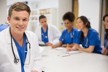 Wall Mural - medical student smiling at the camera during class