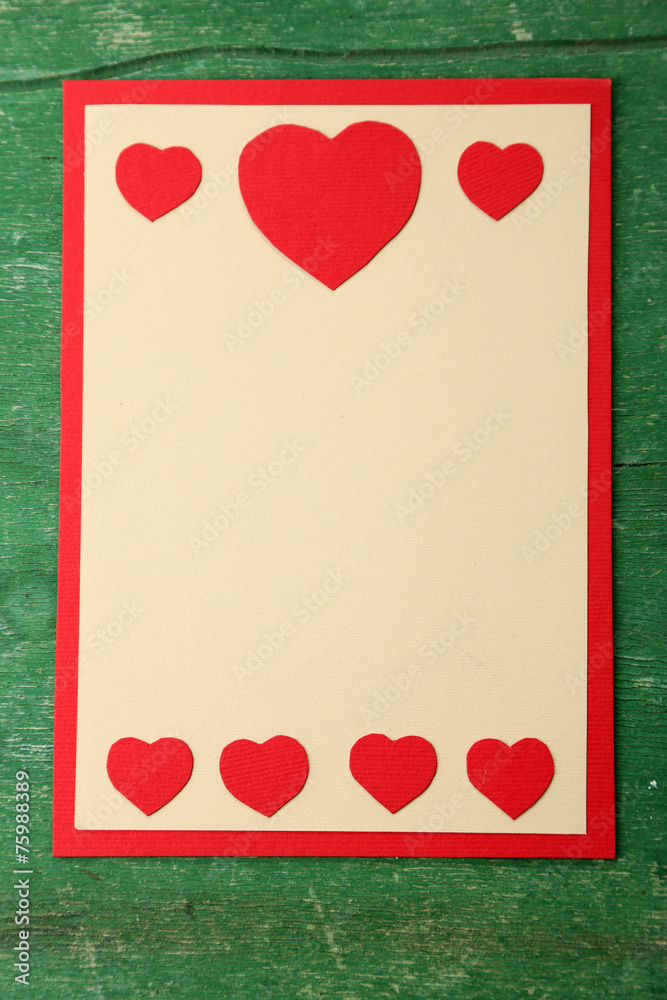 Beautiful hand made post card on color wooden background