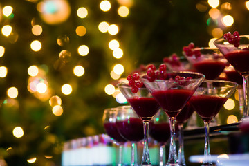 Line of different colored cocktails with smoke on a party