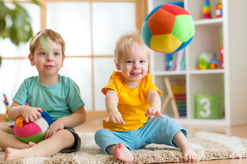 Wall Mural - children playing with soft ball in playroom