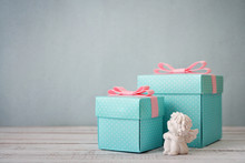 Gift Boxes With Statuette Of Angel