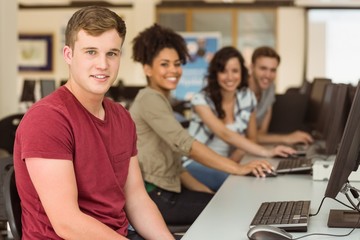 Wall Mural - classmates working in the computer room