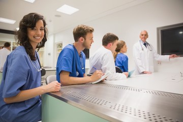 Wall Mural - medical student smiling at the camera during class