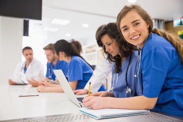 Wall Mural - medical student smiling at the camera during class