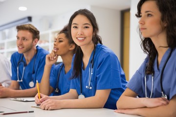 Wall Mural - medical student smiling at the camera during class