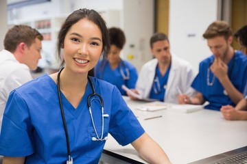 Wall Mural - medical student smiling at the camera during class