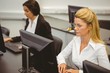 © WavebreakMediaMicro - Focused businesswomen working in computer room
