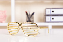 Gold Sunglasses On Table