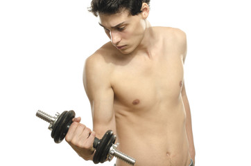 Skinny man training his bicep muscle with a dumbbell, fitness