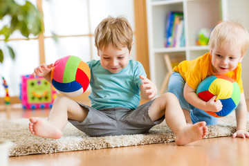 Wall Mural - kids boys play with ball indoor