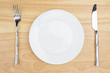 © daizuoxin - Empty dinner plate with knife and fork