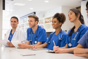 Wall Mural - medical student smiling at the camera during class