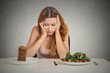 © pathdoc - woman tired of diet restrictions deciding to eat healthy food