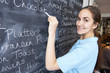 © highwaystarz - Waitress In Restaurant Writing Menu On Blackboard