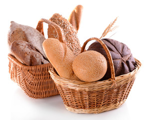 Poster - Different bread in wicker baskets isolated on white