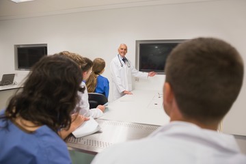 Wall Mural - medical professor teaching young students