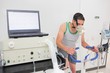 © WavebreakMediaMicro - Man doing fitness test on exercise bike