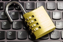 Open Combination Padlock On A Keyboard Symbolizing Data Security