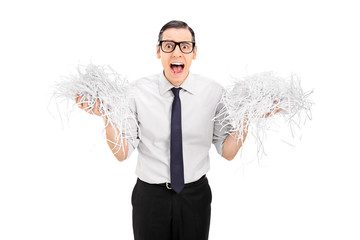 Poster - Terrified man holding a bunch of shredded paper