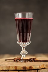 Cherry mulled wine in antique tall glass