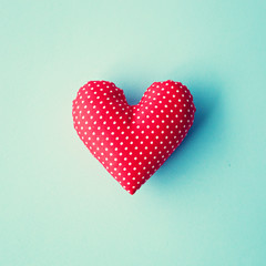 Sticker - Red patterned cotton heart over blue background